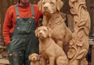 A Carving of Grief, Love, and Legacy: The Story Behind the Woman and the Wooden Dogs